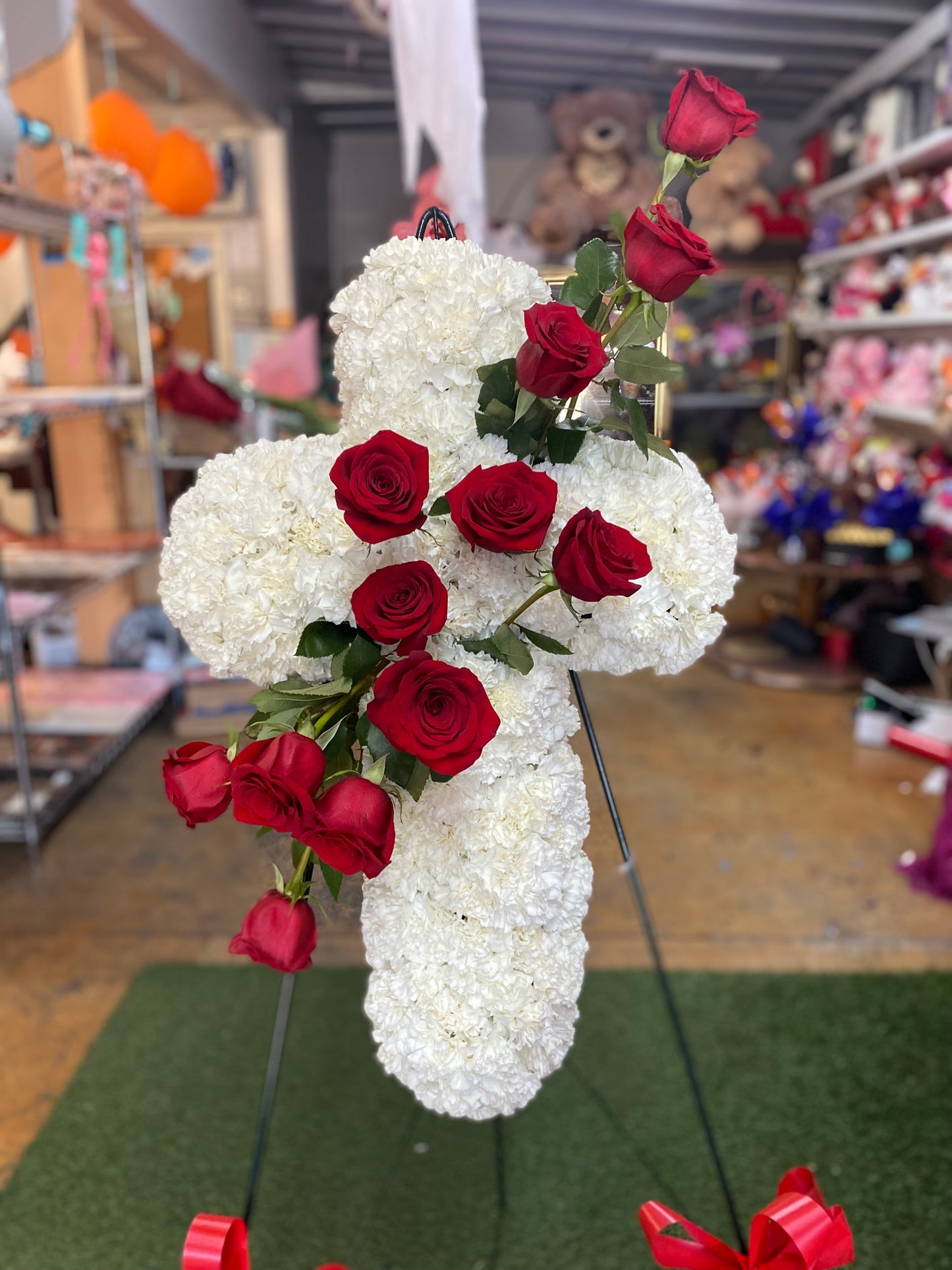 Funeral cross red roses