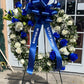 Blue wreath funeral arrangement