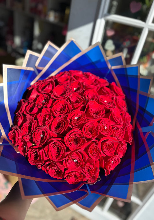 50 red roses w blue wrapping