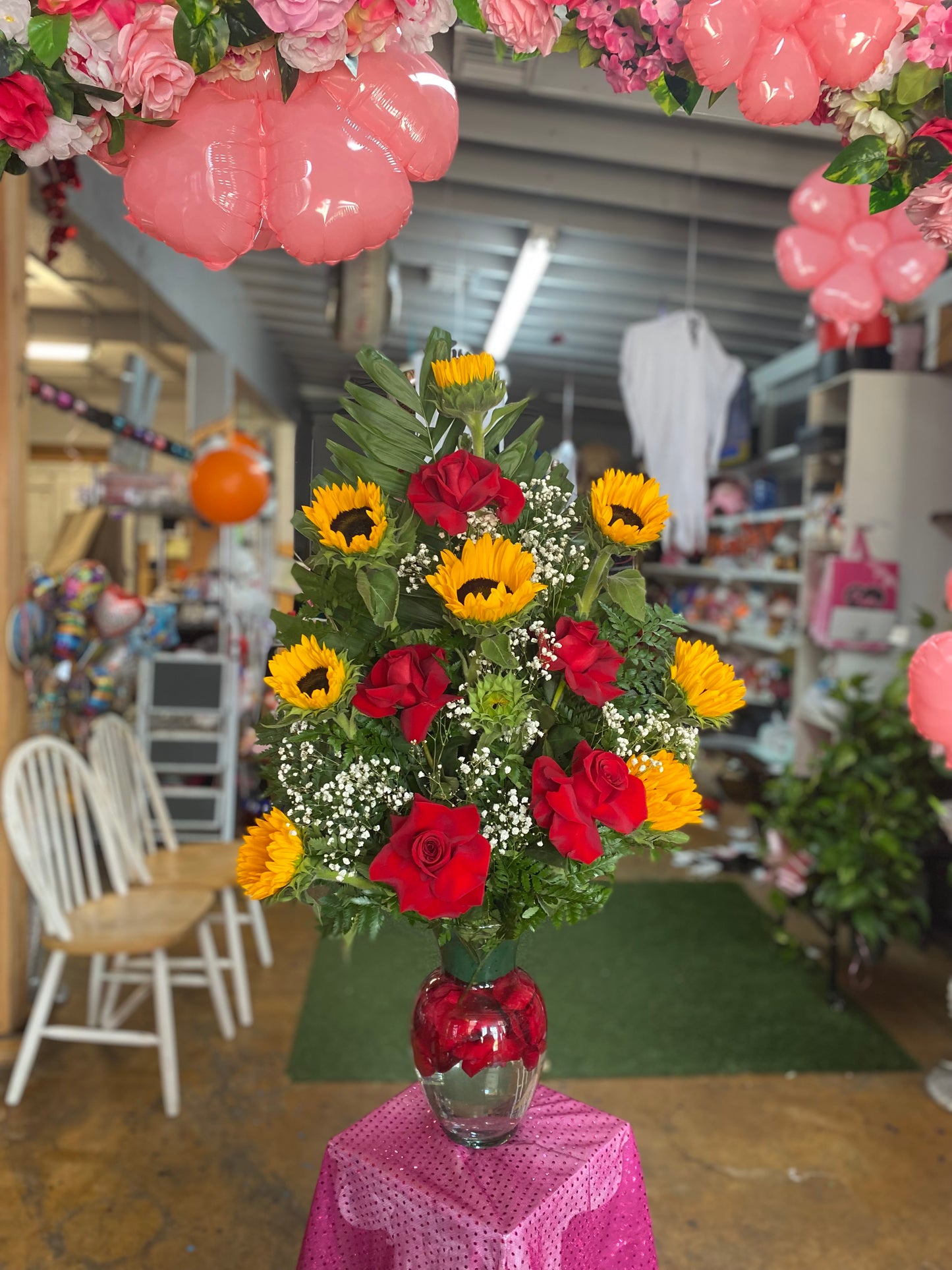 Open roses w sunflower arrangement