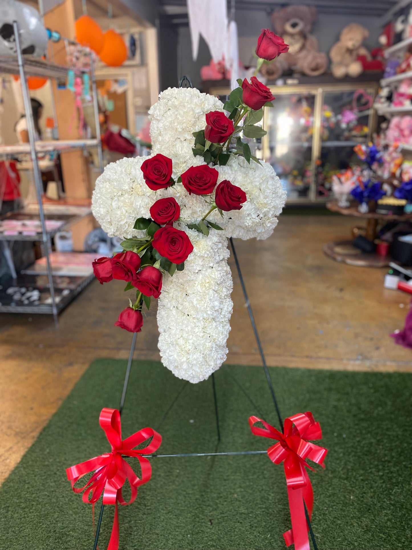 Funeral cross red roses