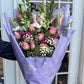 Flat purple wrap bouquet
