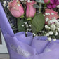 Flat purple wrap bouquet